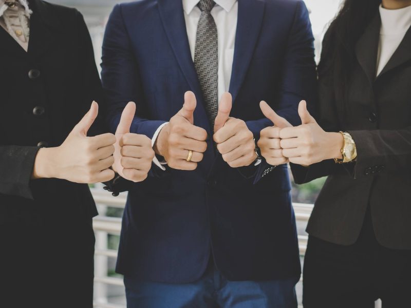 business-team-standing-front-office-successful-business-with-showing-thumbs-up (1)